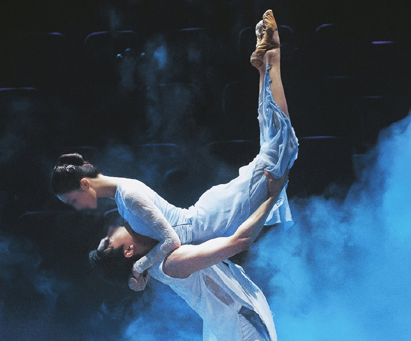 Male dancer lifting a female dancer.